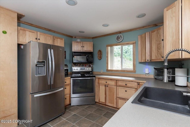 1685 Taroka Dr, Fairbanks, AK 99709 - kitchen featuring appliances with stainless steel finishes, light brown cabinetry, ornamental molding, recessed lighting, and light countertops