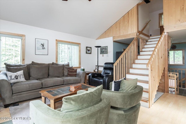 1685 Taroka Dr, Fairbanks, AK 99709 - living room featuring high vaulted ceiling, stairs, light wood finished floors, and a ceiling fan