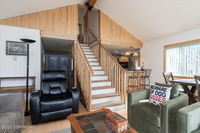 1685 Taroka Dr, Fairbanks, AK 99709 - staircase with wood finished floors and high vaulted ceiling