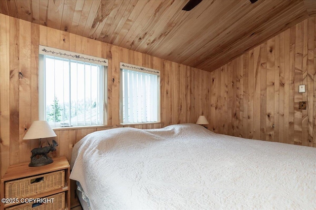 1685 Taroka Dr, Fairbanks, AK 99709 - bedroom featuring multiple windows, wood walls, wooden ceiling, lofted ceiling, and carpet