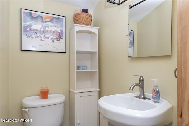 1685 Taroka Dr, Fairbanks, AK 99709 - half bathroom featuring a sink and toilet