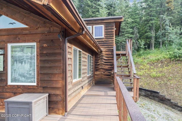 1685 Taroka Dr, Fairbanks, AK 99709 - deck featuring stairway and a view of trees