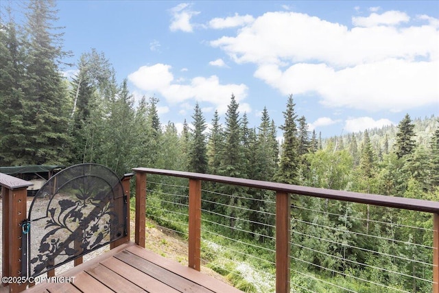 1685 Taroka Dr, Fairbanks, AK 99709 - wooden deck featuring a wooded view