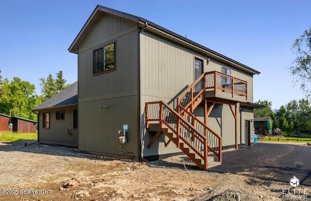 1401 E Holland Ave, Wasilla, AK 99654 - rear view of house with stairway and roof with shingles