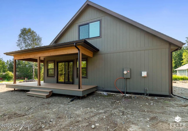 1401 E Holland Ave, Wasilla, AK 99654 - back of house featuring covered porch