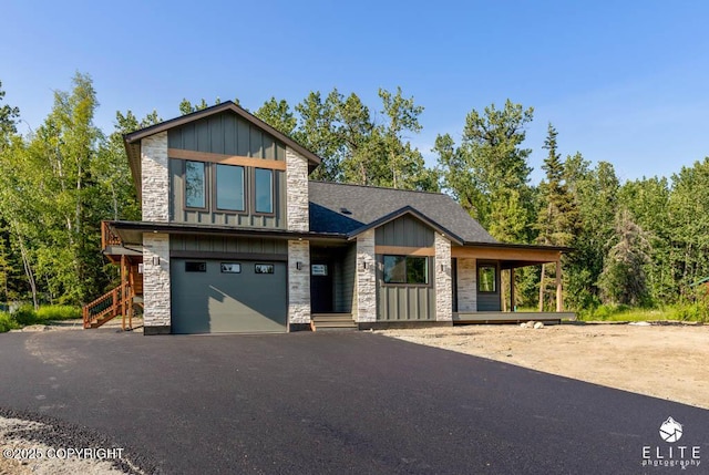 1401 E Holland Ave, Wasilla, AK 99654 - modern home featuring stone siding, driveway, a garage, and board and batten siding