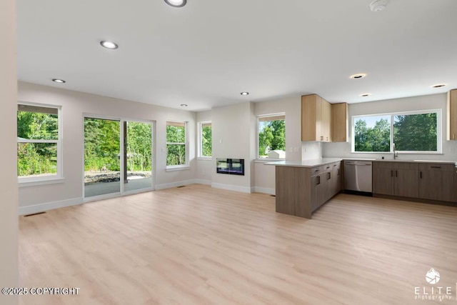1401 E Holland Ave, Wasilla, AK 99654 - kitchen with dishwasher, open floor plan, healthy amount of natural light, light countertops, and recessed lighting