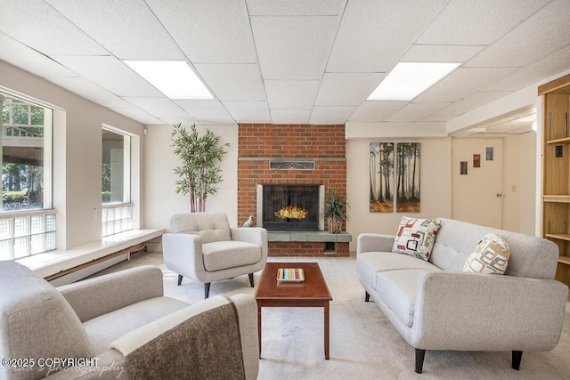 15021 Old Seward Hwy, Anchorage, AK 99516 - living room featuring carpet flooring, healthy amount of natural light, a fireplace, and a drop ceiling