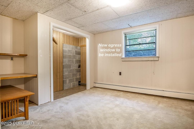15021 Old Seward Hwy, Anchorage, AK 99516 - unfurnished bedroom with a baseboard heating unit, carpet floors, and wood walls