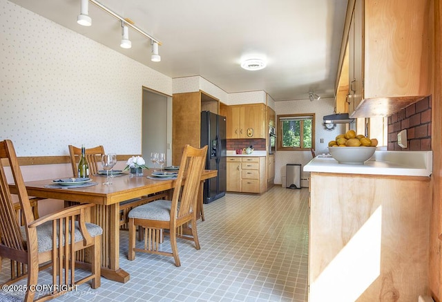 15021 Old Seward Hwy, Anchorage, AK 99516 - dining room featuring wallpapered walls, rail lighting, and light tile patterned floors
