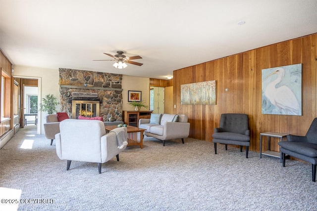 15021 Old Seward Hwy, Anchorage, AK 99516 - carpeted living area featuring wood walls, ceiling fan, and a fireplace