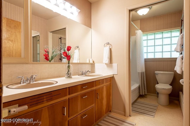 15021 Old Seward Hwy, Anchorage, AK 99516 - full bath with double vanity, shower / tub combo with curtain, tasteful backsplash, and wallpapered walls
