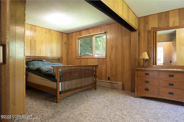 15021 Old Seward Hwy, Anchorage, AK 99516 - carpeted bedroom featuring baseboard heating, a textured ceiling, and wood walls