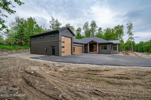 1770 S Corwin Ln, Wasilla, AK 99654 - contemporary house with asphalt driveway and a garage