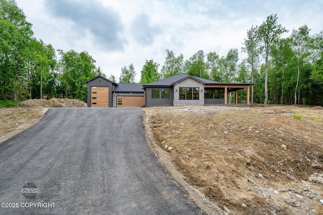 1770 S Corwin Ln, Wasilla, AK 99654 - contemporary house featuring a garage and asphalt driveway