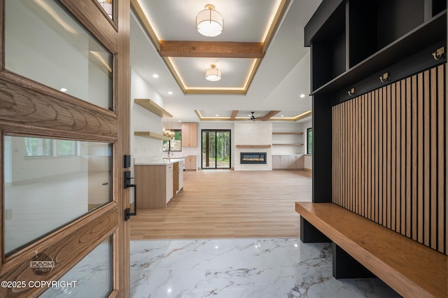 1770 S Corwin Ln, Wasilla, AK 99654 - mudroom featuring plenty of natural light, a large fireplace, and ceiling fan