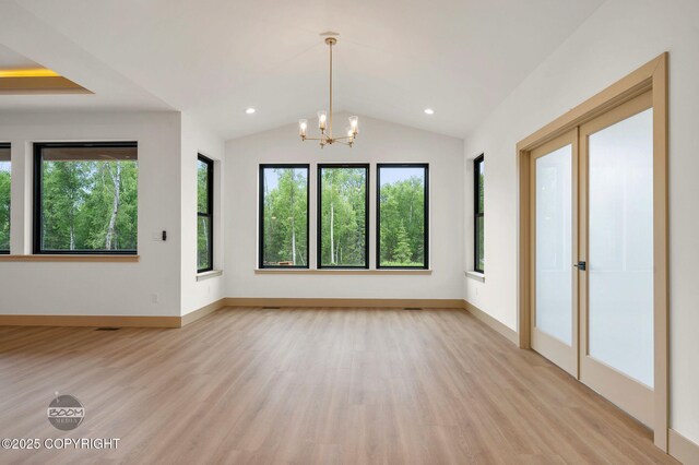 1770 S Corwin Ln, Wasilla, AK 99654 - empty room featuring light wood finished floors, a chandelier, vaulted ceiling, and recessed lighting