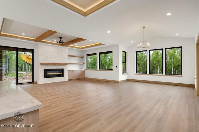 1770 S Corwin Ln, Wasilla, AK 99654 - unfurnished living room featuring a fireplace, a chandelier, a ceiling fan, light wood finished floors, and recessed lighting