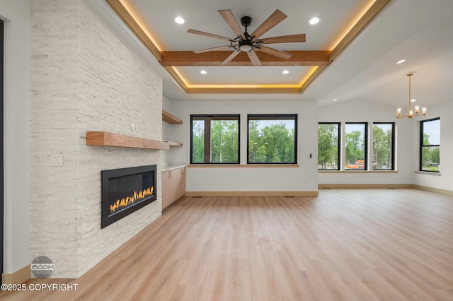 1770 S Corwin Ln, Wasilla, AK 99654 - unfurnished living room featuring a fireplace, a chandelier, a ceiling fan, light wood-style floors, and recessed lighting