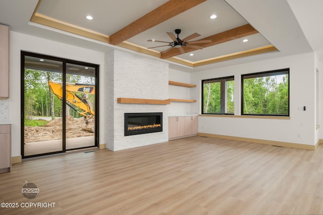 1770 S Corwin Ln, Wasilla, AK 99654 - unfurnished living room with a fireplace, ceiling fan, healthy amount of natural light, light wood finished floors, and recessed lighting