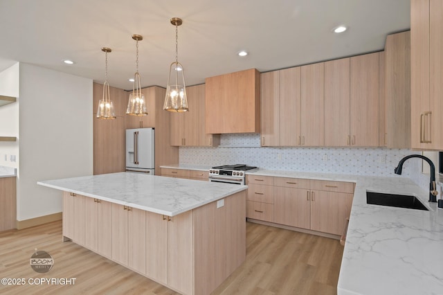 1770 S Corwin Ln, Wasilla, AK 99654 - kitchen featuring light brown cabinets, high end appliances, a kitchen island, light stone counters, and recessed lighting