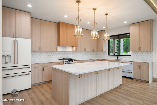 1770 S Corwin Ln, Wasilla, AK 99654 - kitchen featuring high quality appliances, light brown cabinetry, light stone counters, and recessed lighting