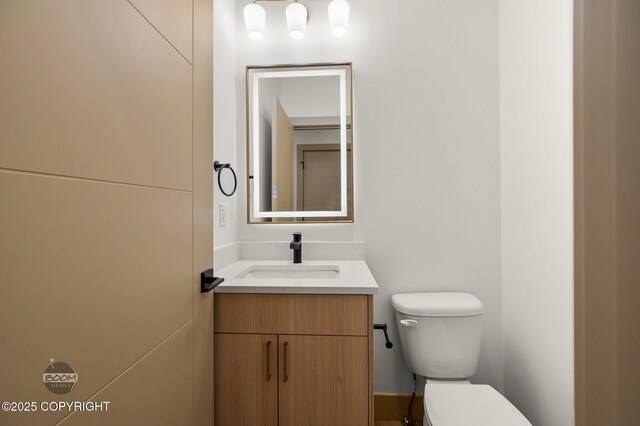 1770 S Corwin Ln, Wasilla, AK 99654 - half bathroom featuring toilet and vanity