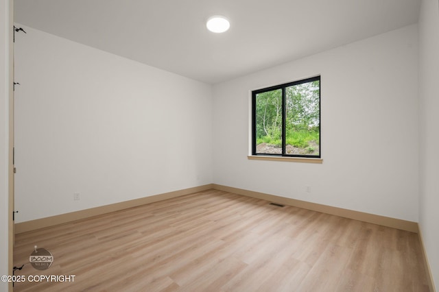 1770 S Corwin Ln, Wasilla, AK 99654 - unfurnished room featuring light wood-type flooring and baseboards