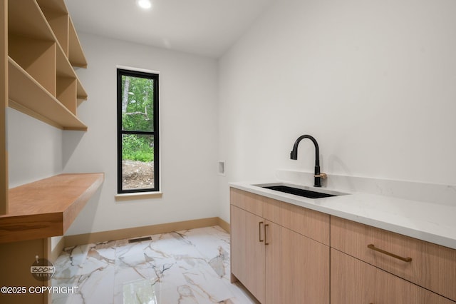 1770 S Corwin Ln, Wasilla, AK 99654 - laundry area with light marble finish flooring, cabinet space, recessed lighting, and washer hookup
