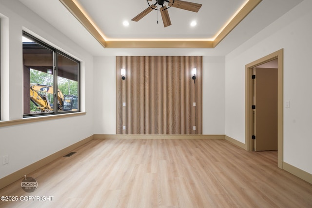 1770 S Corwin Ln, Wasilla, AK 99654 - empty room featuring light wood-style floors, ceiling fan, a tray ceiling, and recessed lighting