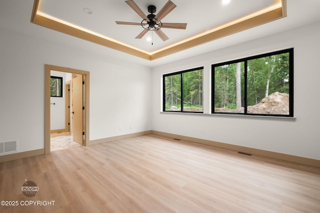 1770 S Corwin Ln, Wasilla, AK 99654 - spare room with a raised ceiling, light wood-style floors, ceiling fan, and recessed lighting