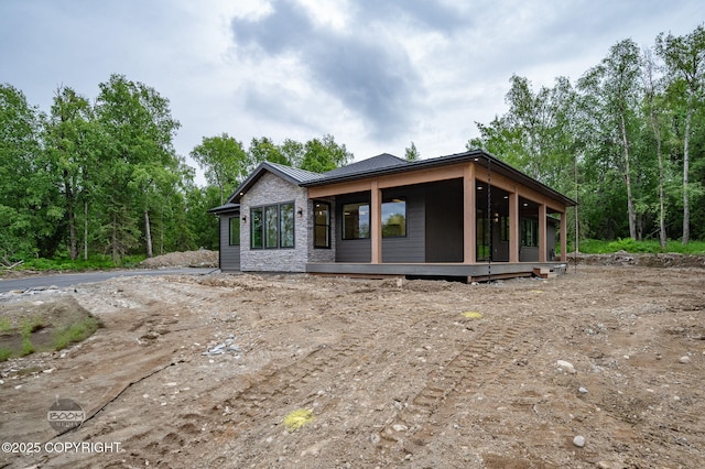 1770 S Corwin Ln, Wasilla, AK 99654 - view of front of property featuring a standing seam roof, a metal roof, and stone siding