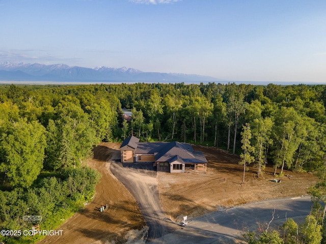 1770 S Corwin Ln, Wasilla, AK 99654 - aerial view of property and surrounding area with a heavily wooded area and mountains