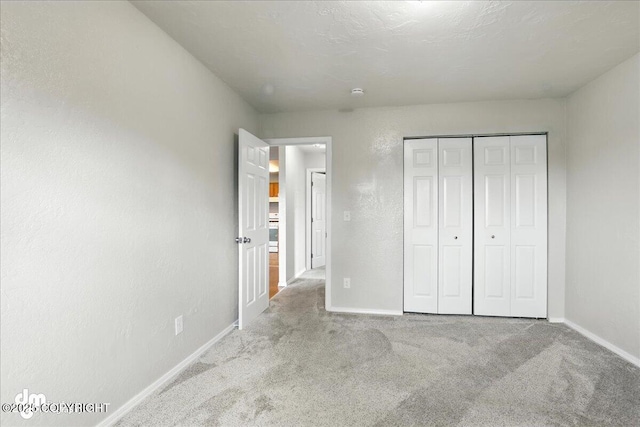 8203 Duben Ave, Anchorage, AK 99504 - unfurnished bedroom featuring carpet flooring and a closet