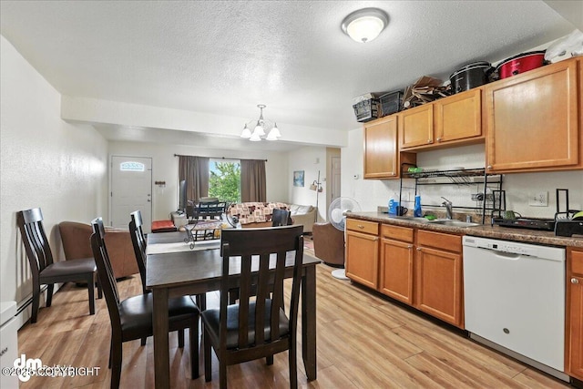 8203 Duben Ave, Anchorage, AK 99504 - kitchen featuring dishwasher, a chandelier, light wood-style flooring, a textured ceiling, and hanging light fixtures