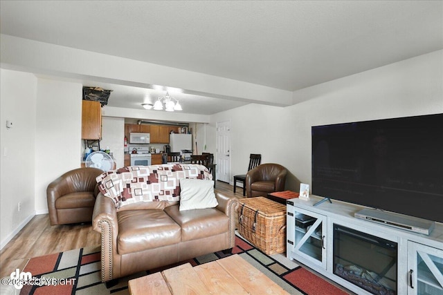8203 Duben Ave, Anchorage, AK 99504 - living room with a chandelier and light wood-type flooring