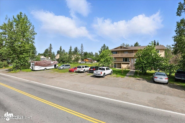 8203 Duben Ave, Anchorage, AK 99504 - uncovered parking lot featuring stairway