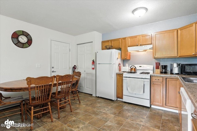 8203 Duben Ave, Anchorage, AK 99504 - kitchen featuring white appliances, under cabinet range hood, stone finish floors, and light countertops