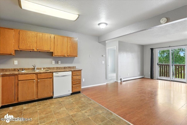8203 Duben Ave, Anchorage, AK 99504 - kitchen featuring dishwasher, a baseboard radiator, a textured ceiling, open floor plan, and brown cabinetry