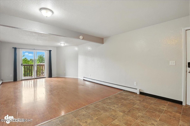 8203 Duben Ave, Anchorage, AK 99504 - spare room featuring baseboard heating and a textured ceiling
