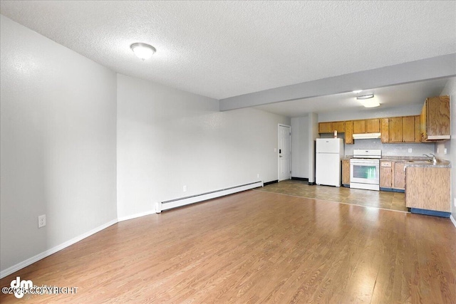 8203 Duben Ave, Anchorage, AK 99504 - unfurnished living room with a baseboard heating unit, a textured ceiling, and wood finished floors
