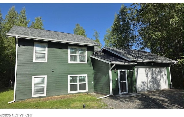 3900 N Mirmar St, Wasilla, AK 99623 - back of house featuring a garage and driveway