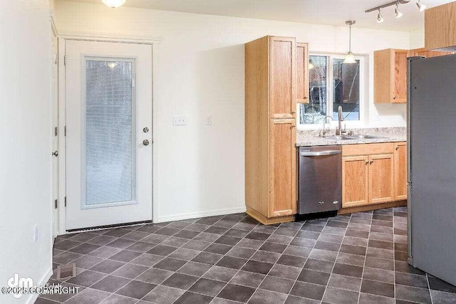 3900 N Mirmar St, Wasilla, AK 99623 - kitchen featuring appliances with stainless steel finishes, light countertops, decorative light fixtures, and track lighting