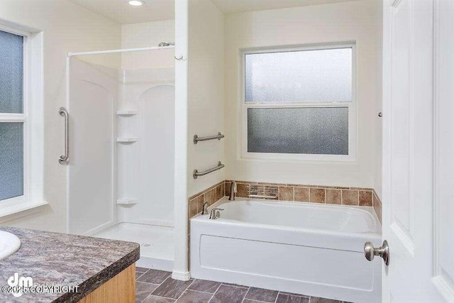 3900 N Mirmar St, Wasilla, AK 99623 - full bathroom featuring a garden tub, vanity, and walk in shower