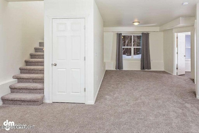 3900 N Mirmar St, Wasilla, AK 99623 - carpeted empty room with stairs and a smoke detector