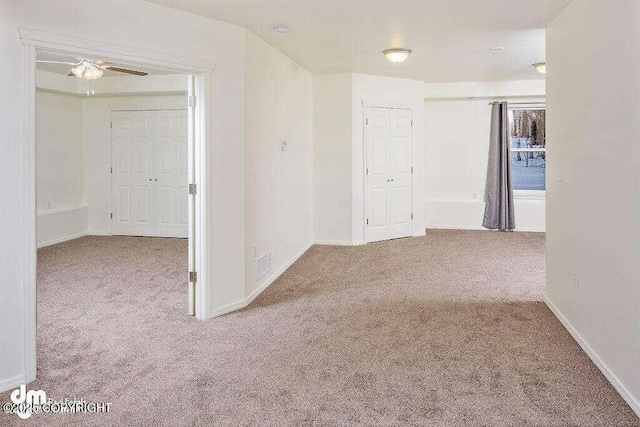 3900 N Mirmar St, Wasilla, AK 99623 - carpeted spare room featuring baseboards and a ceiling fan