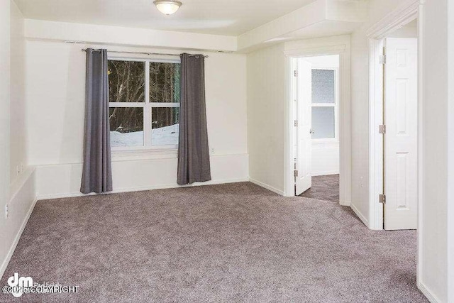 3900 N Mirmar St, Wasilla, AK 99623 - carpeted empty room featuring baseboards