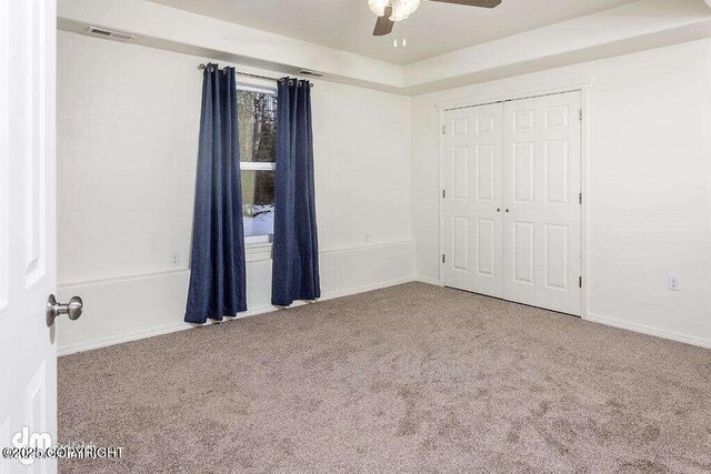 3900 N Mirmar St, Wasilla, AK 99623 - unfurnished bedroom with carpet flooring, a closet, and a ceiling fan