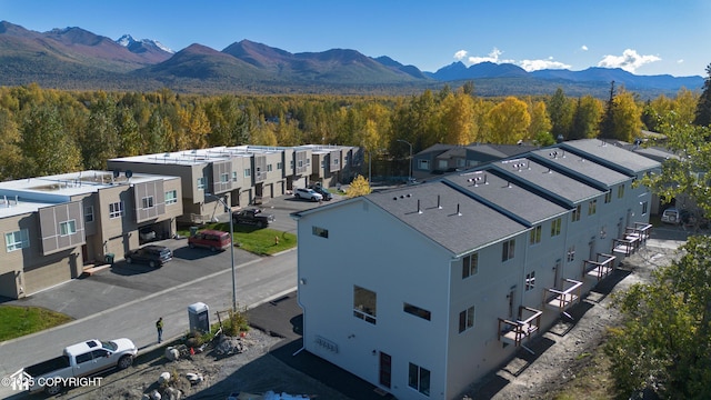 3680 Little Bear Pl Unit 8, Anchorage, AK 99504 - aerial view of residential area featuring a mountain backdrop and a forest