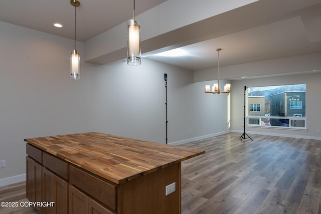 3680 Little Bear Pl Unit 8, Anchorage, AK 99504 - kitchen with butcher block countertops, open floor plan, wood finished floors, pendant lighting, and recessed lighting